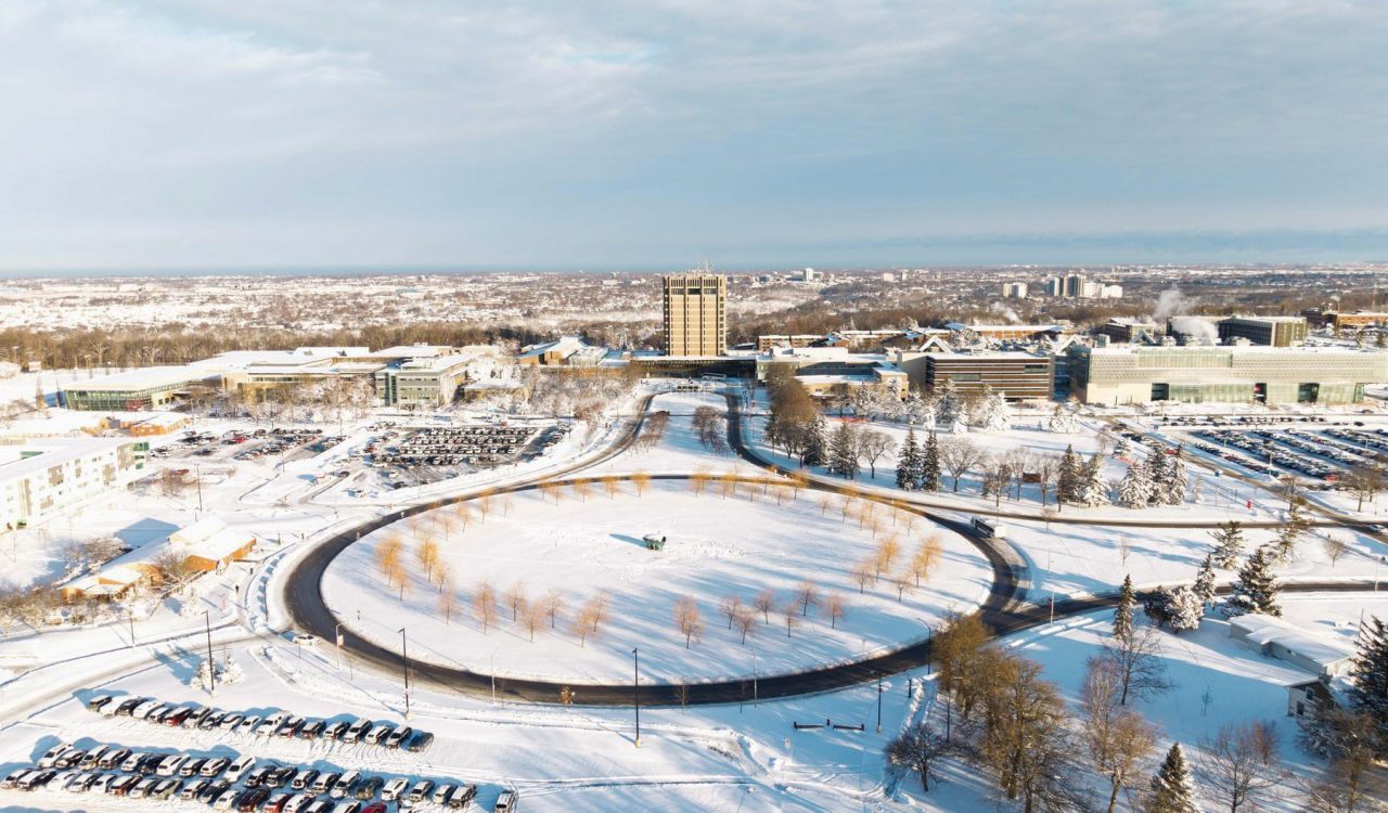 An aerial view of Brock University's main campus, covered in snow.