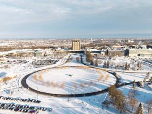 An aerial view of Brock University's main campus, covered in snow.