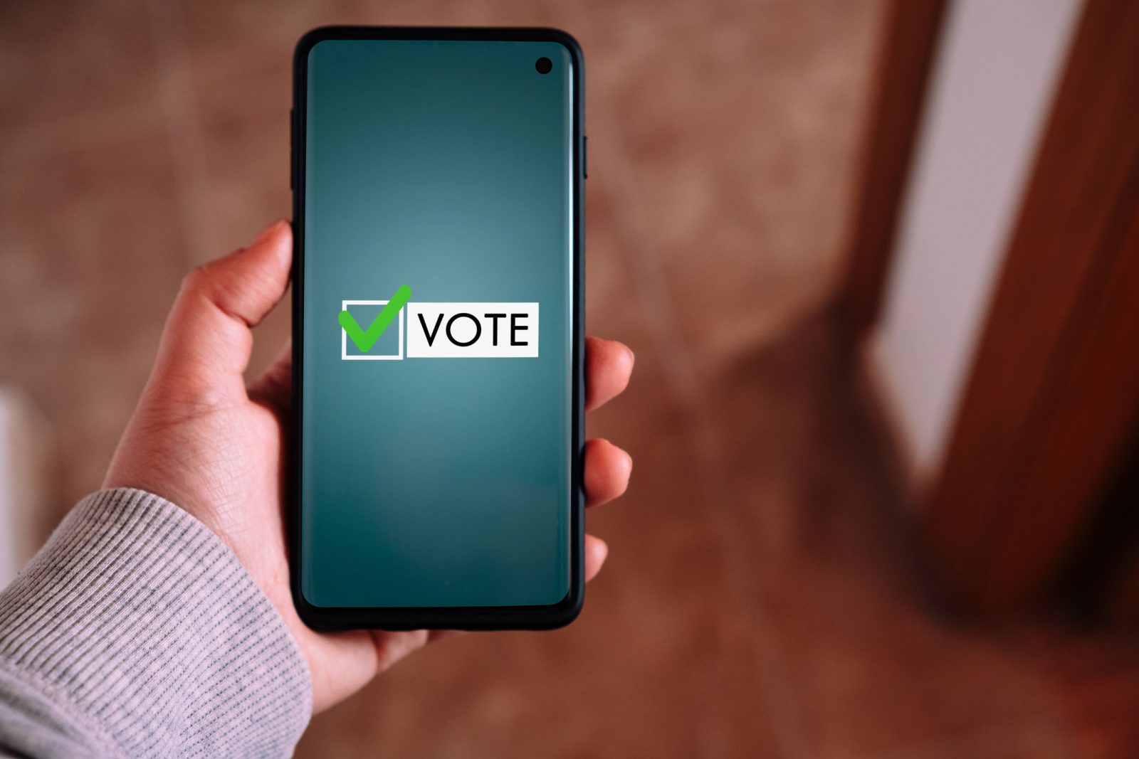A phone screen showing a voting checkbox.