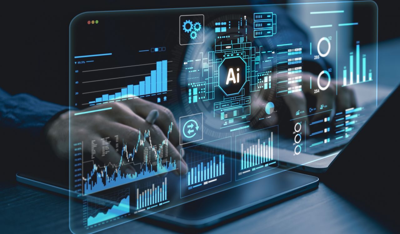 Close-up view of hands typing on a computer with AI and technology images hovering in the foreground,