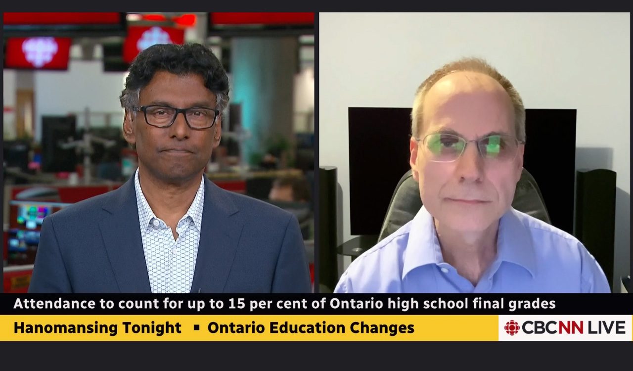 Two men do a virtual television interview in split screen mode.