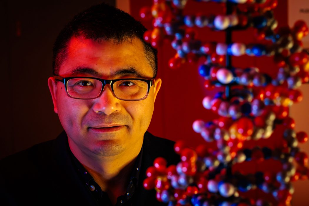 Jianbo Gao with a molecular model of coloured balls connected by sticks.