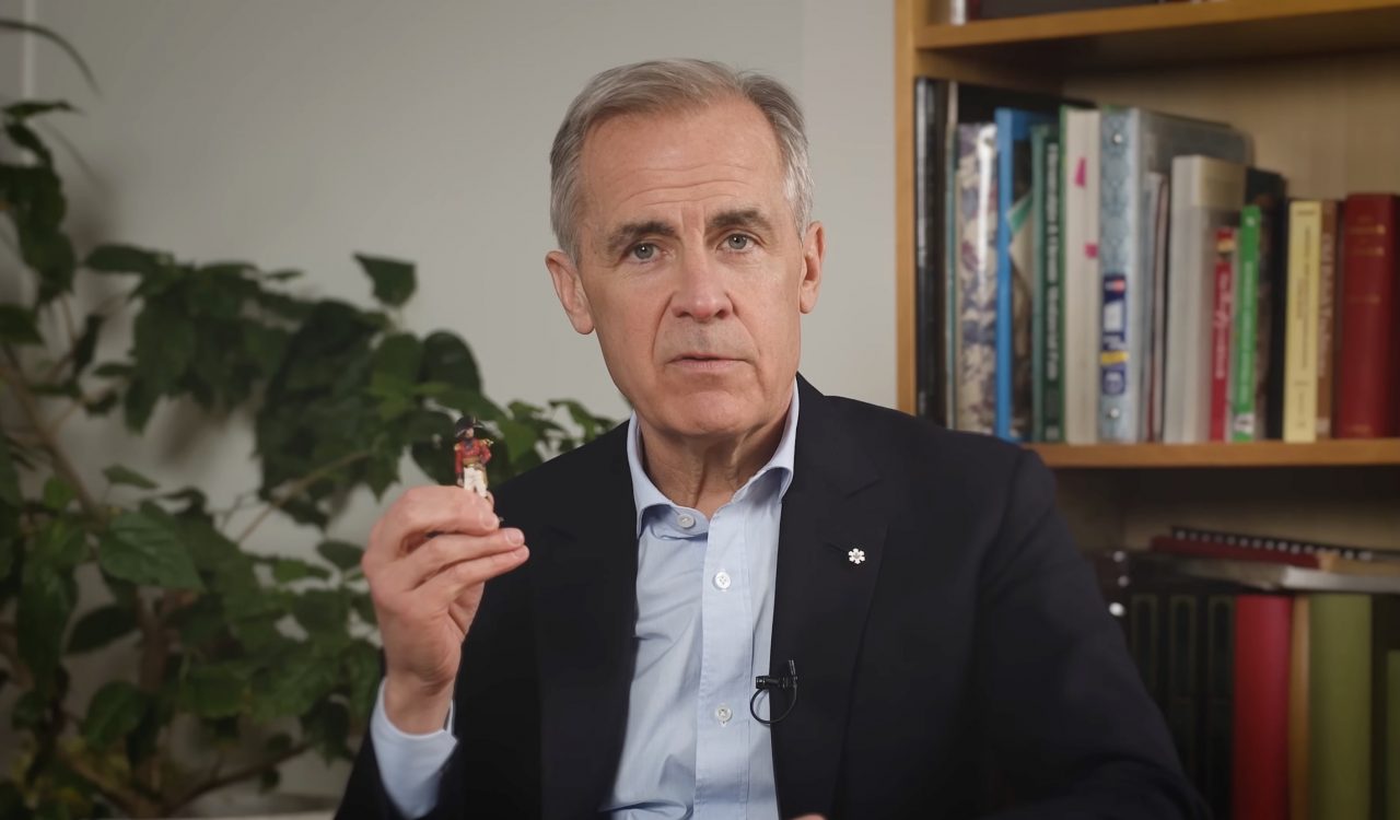 Prime Minister Mark Carney holds a tiny figurine of Maj.-Gen. Sir Isaac Brock.