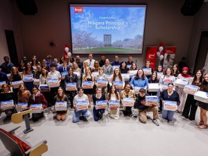 A group of Niagara Principal’s Scholarship recipients pose with their Brock welcome boxes during the 2026 award ceremony.