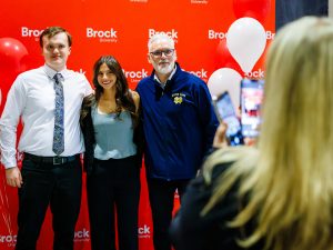 Scholarship recipients and a guest pose for a photo in front of a Brock University backdrop during the Niagara Principal’s Scholarship celebration.