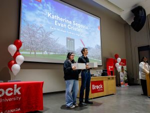 Two Niagara Principal’s Scholarship recipients are recognized on stage during the ceremony at Brock University.