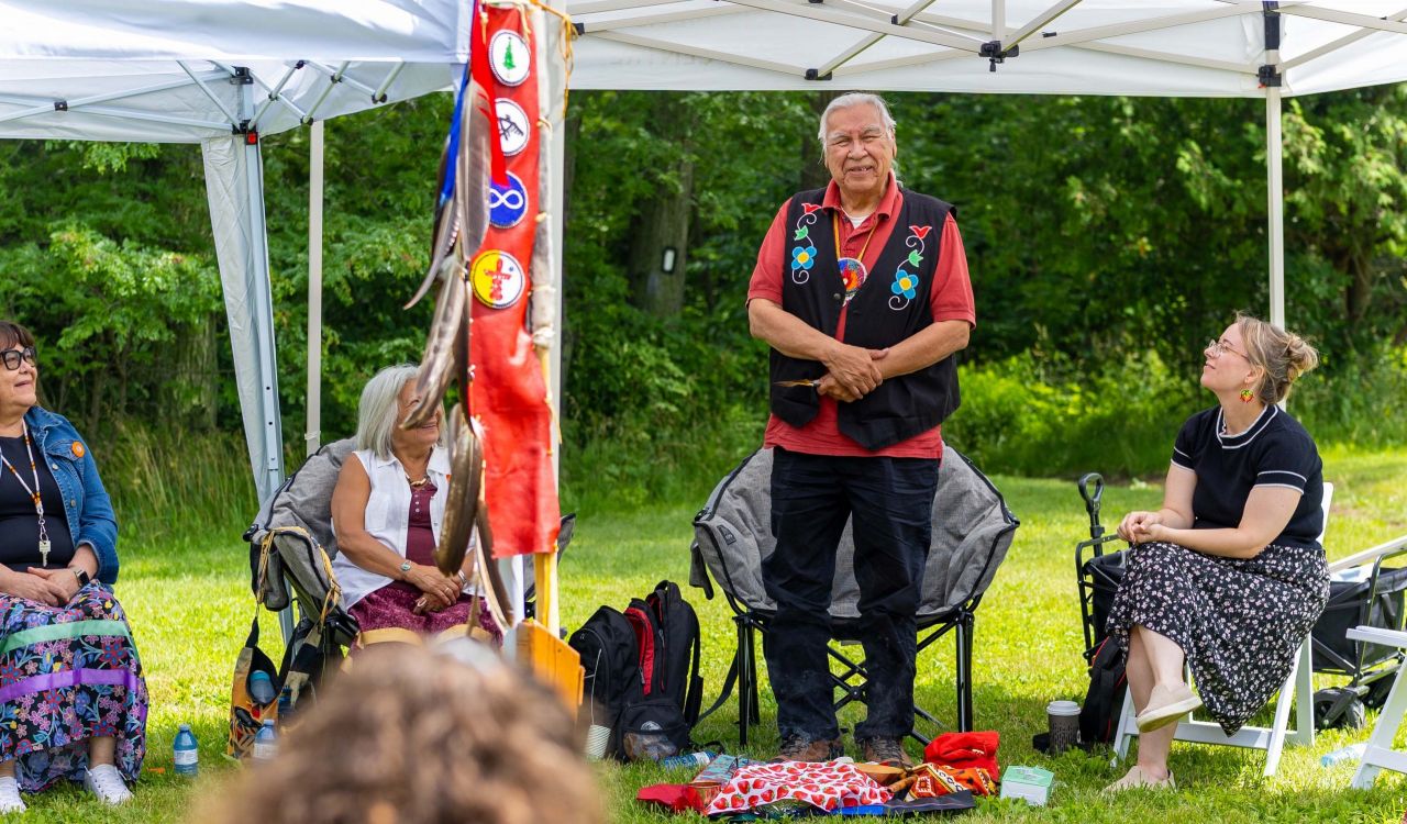 Elder Peter Beaucage stands during a traditional Naming Ceremony.