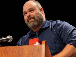 A man stands at a podium making a speech.