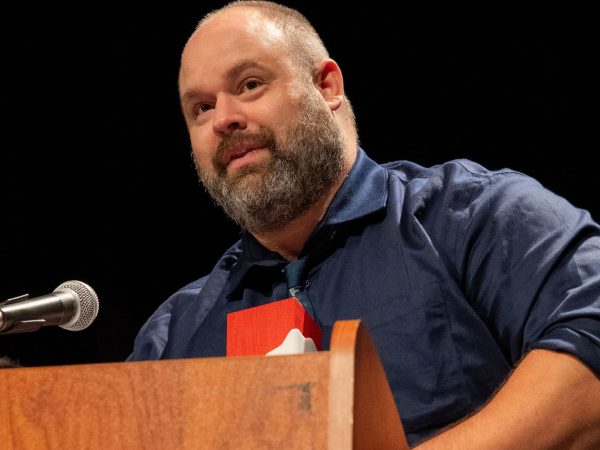 A man stands at a podium making a speech.