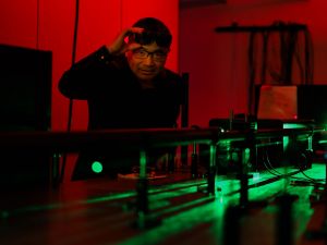 Jianbo Gao works with lasers in a Brock University research lab.