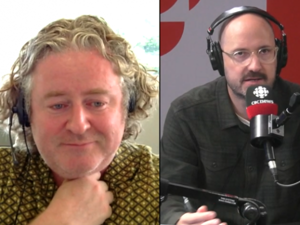On the left side of a split screen, a man is seated in an office wearing headphones and appears to be listening intently. On the right side, a man is seated in a studio, wearing large headphones, speaking into a CBC News microphone.