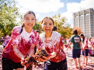 Students stomping grapes at Brock University.
