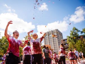 Students throw grapes in the air at Brock's annual grape stomp.
