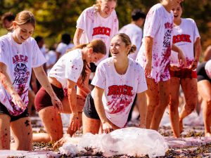 Students stomping grapes at Brock University.
