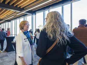 People speak to each other a networking event.
