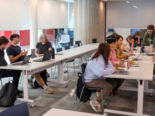 Students and organizers work collaboratively on laptops at Wikipedia Edit-a-thon event at Brock University.