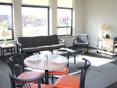 Living room and dining area in Gateway Suites apartment