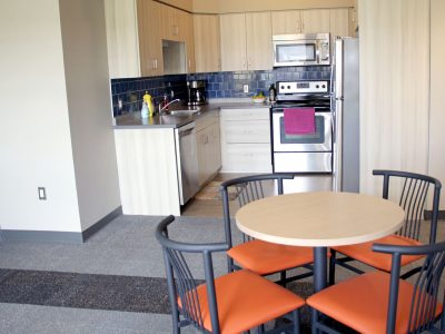 Kitchen and dining area in Gateway Suites apartment