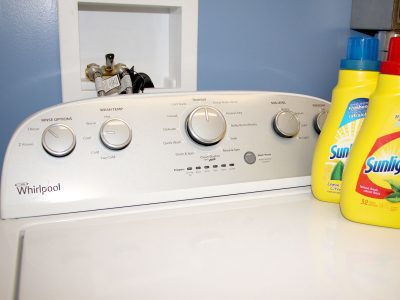 Washer and dryer unit with Sunlight detergent sitting on top