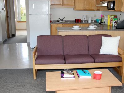 Living room and dining area in Quarry View apartment