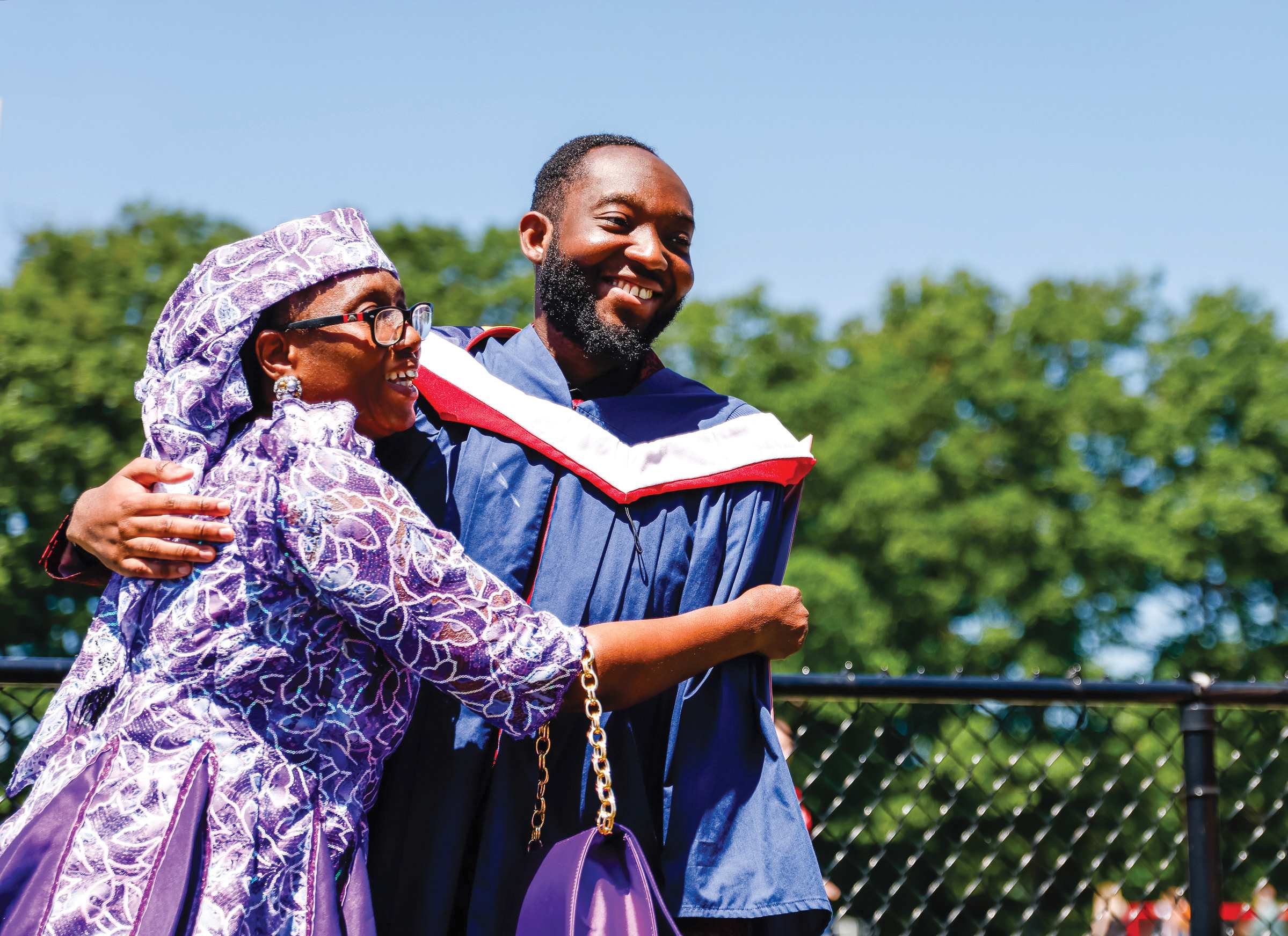 Parent and student on Graduation day hugging and smiling