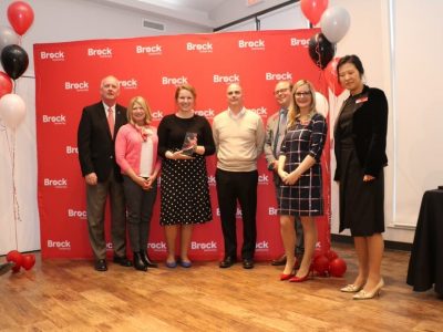 Betista Fran Bonomi, HR Coordinator and Kayla Schipper, Staff accountant accepting the award
