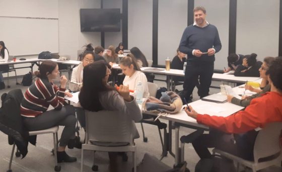 Students and teacher in a skills development workshop