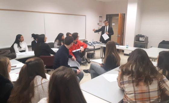 Speaker in classroom lecturing students