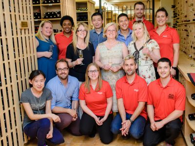 staff and students inside wine room