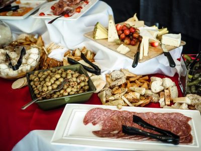 various meats, cheeses and olives laid out buffet style