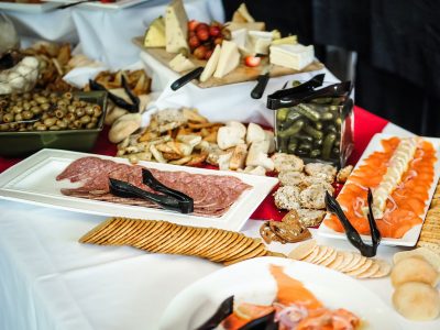 various meats, cheeses and olives laid out buffet style