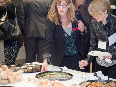 students enjoying food from buffet table
