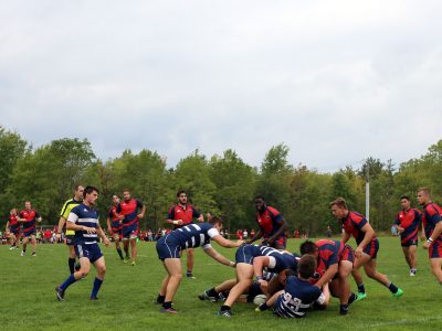 Brock University's Men's rugby team tackle on alumni field