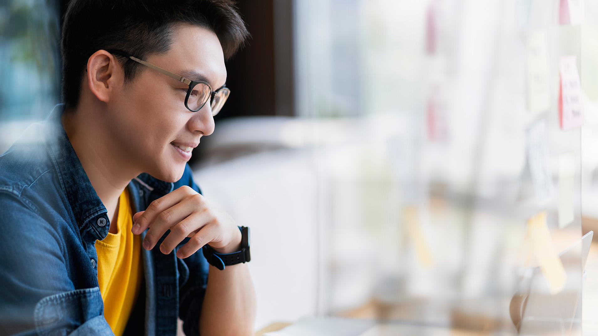 side profile of man with glasses 