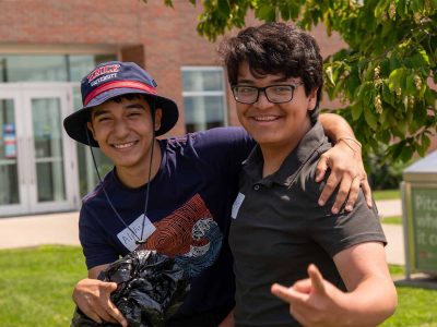 Two male students smiling for photo