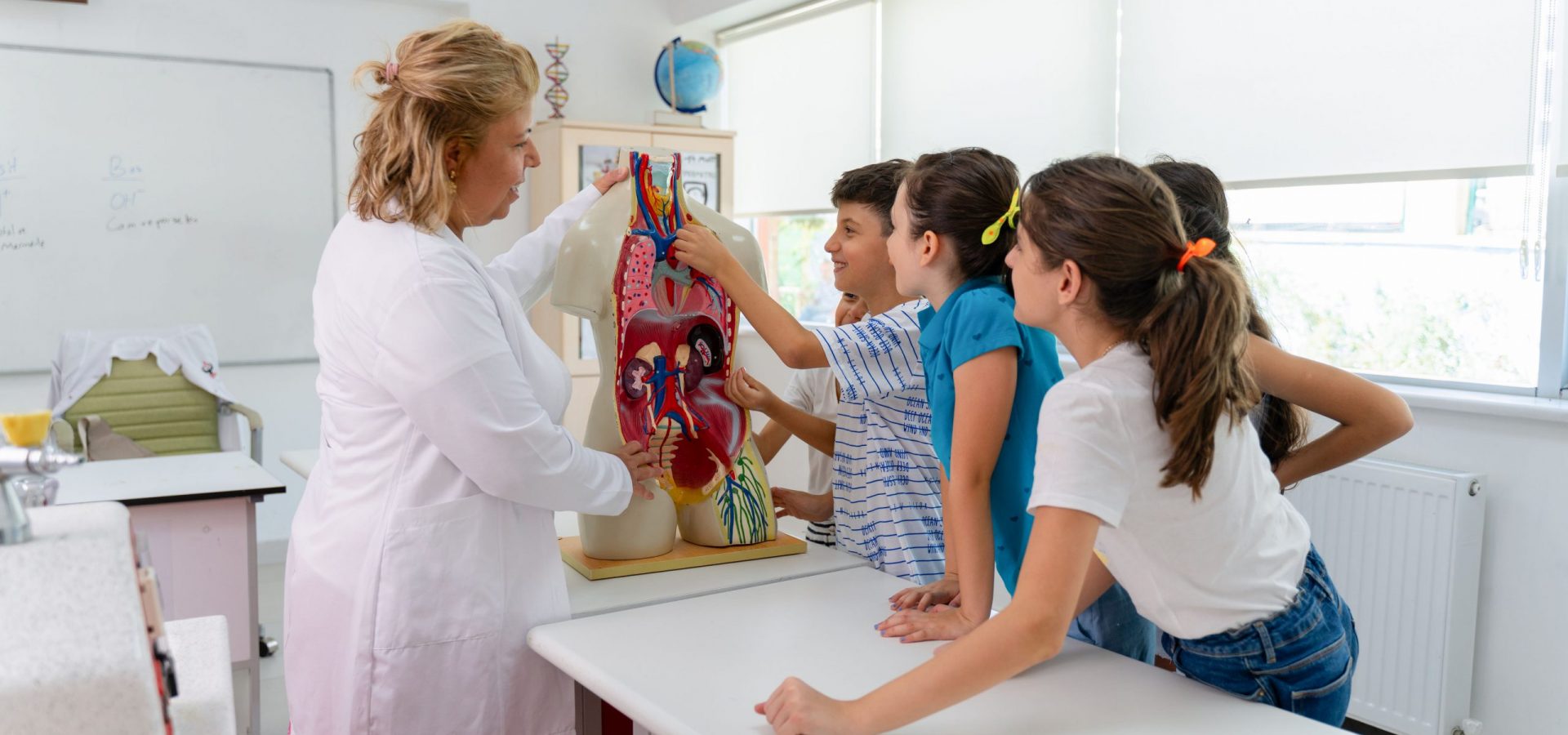 Students learning science with teacher.