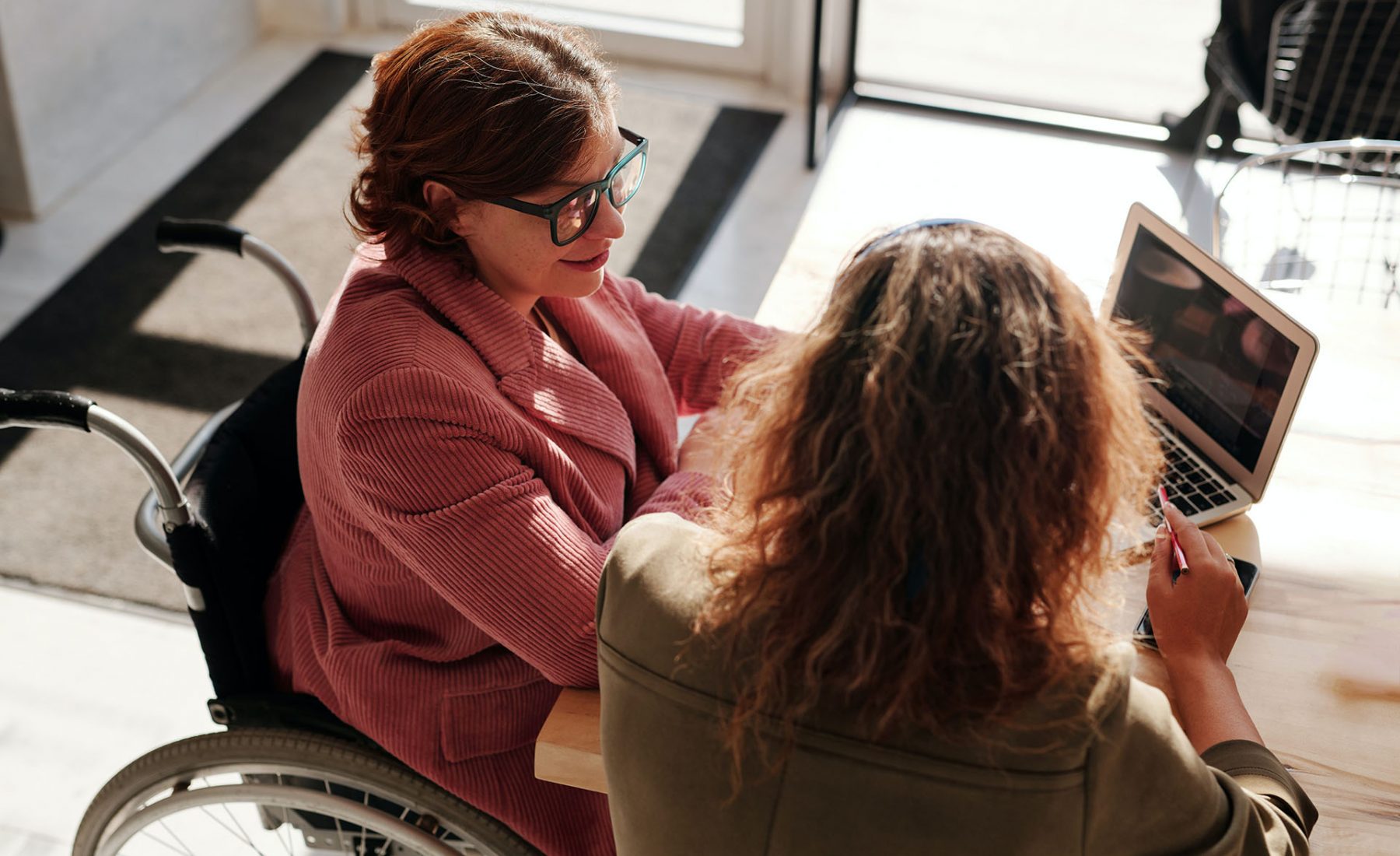 Woman in Red Sweater Wearing Black Framed Eyeglasses Sitting on Wheelchair 