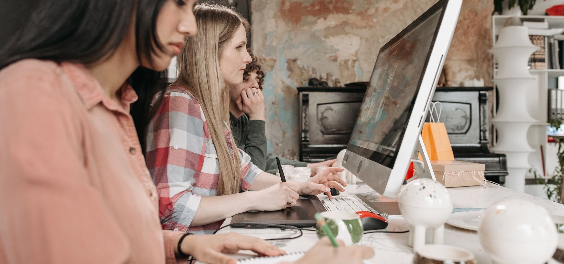 Project Management for Creative Industries students looking at computer