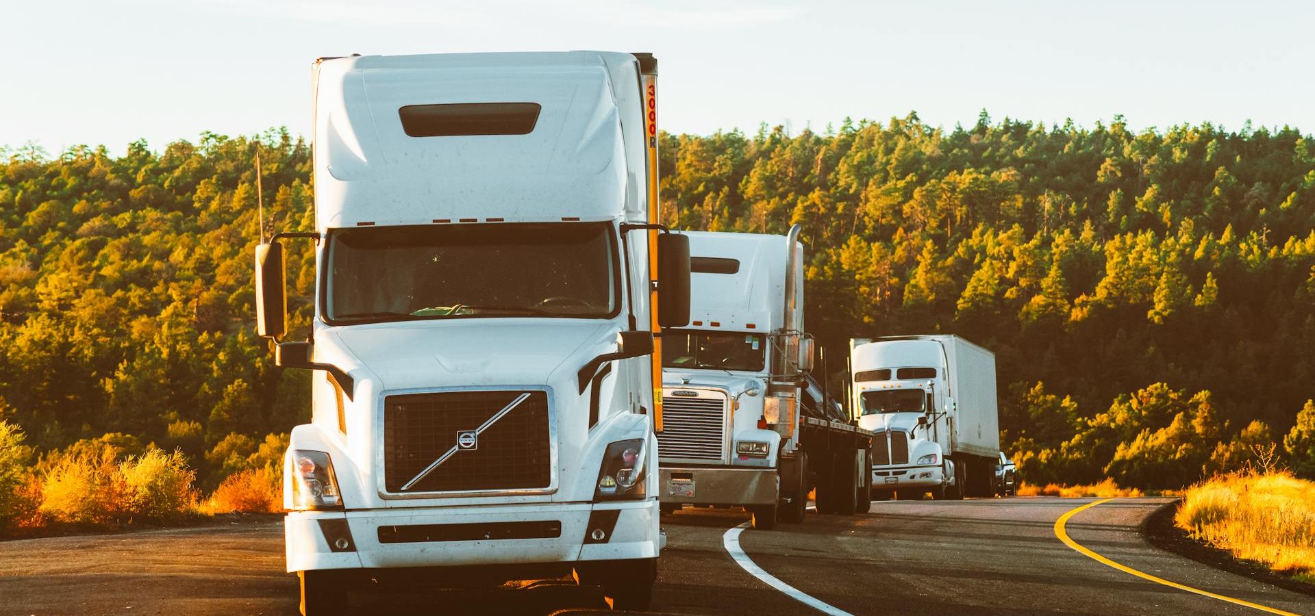 a row of trucks on a road