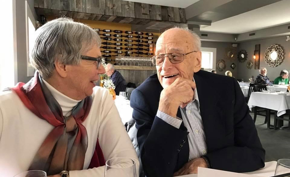Arthur and Judy Kingsley enjoy each other's company and conversation while seated at a restaurant table.