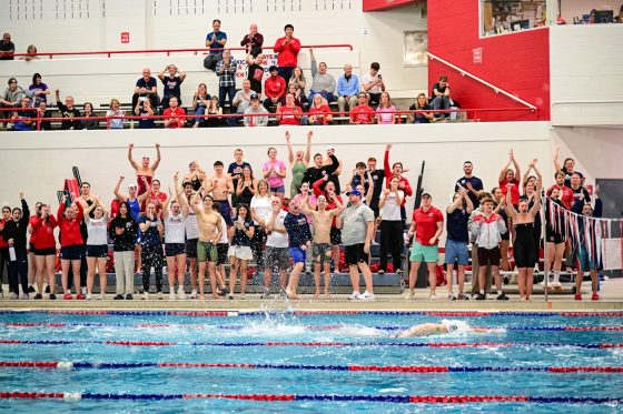 Looking across Brock's swim pool there is a crowd celebrating.