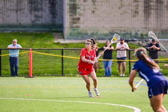 Woman's lacrosse player getting ready to throw
