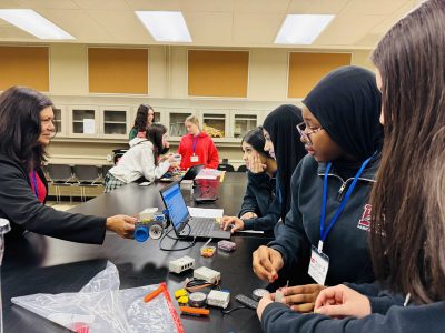 Students work on a robot car.