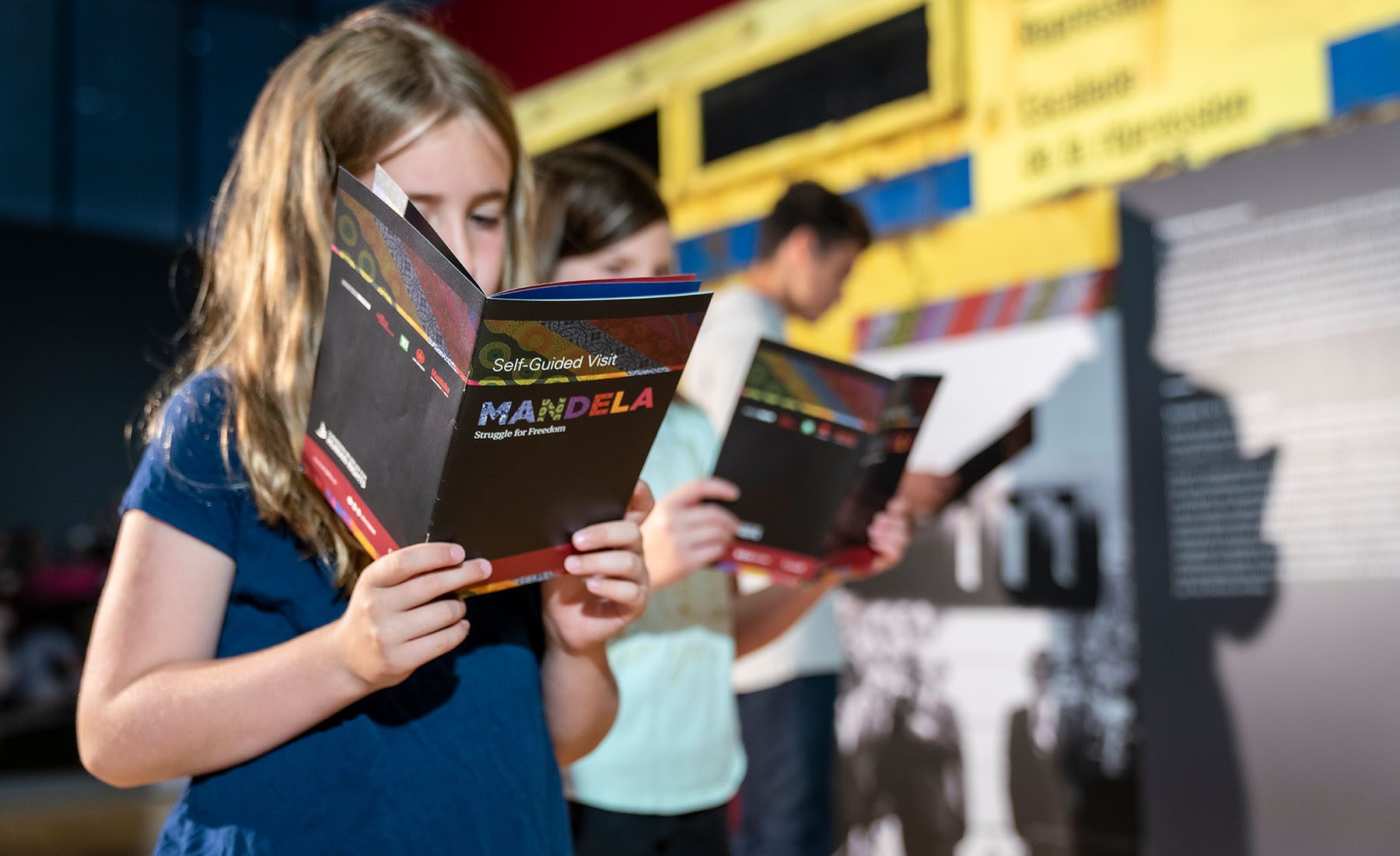 A child uses new educational materials as they tour the Mandela: Struggle for Freedom exhibit at the Canadian Museum for Human Rights in Winnipeg.