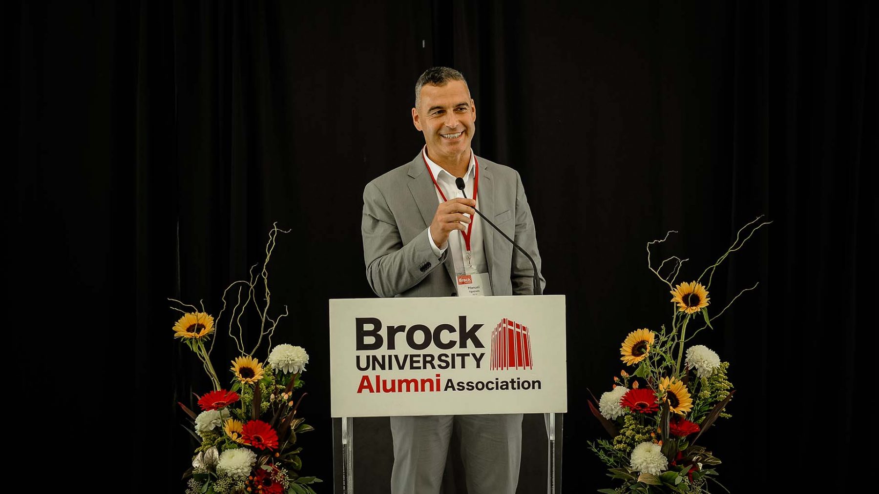 Manny Figueiredo accepting the Faculty of Education Distinguished Graduate Award at Brock University.