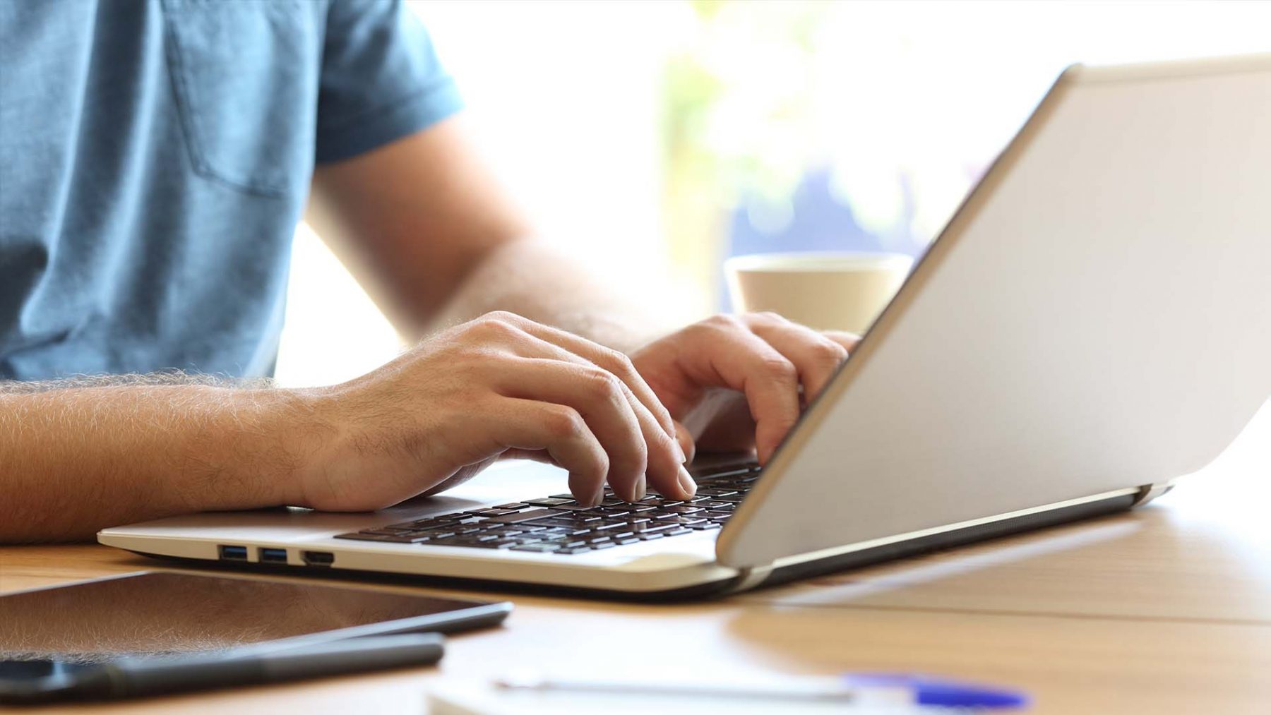 Person typing on a laptop
