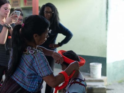 Brock students learning about traditional Mayan clothes