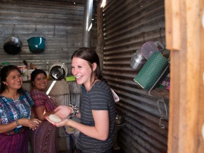 Brock student Melissa Teichgraf learns to make tortillas with a local family in Guatemala.