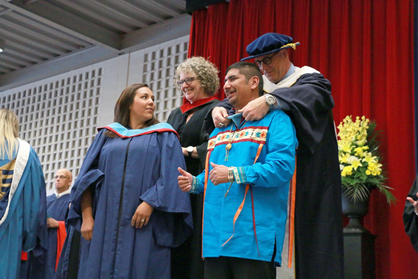 Darcy Belanger is hooded by Vice-President, Administration Brian Hutchings during Wednesday's Faculty of Education Convocation ceremony.