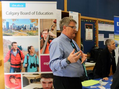 Tracey McIvor, Teacher Consultant with the Calgary Board of Education, discusses opportunities available in Calgary with second-year Consecutive Teacher Education Student Kristian Fernandez-Brown.
